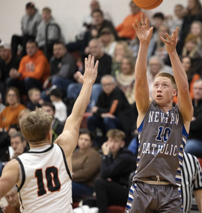 Newman’s George Jungerman puts up a three-point shot against Byron Friday, Dec. 19, 2025, in the Forreston Holiday Tournament title game.