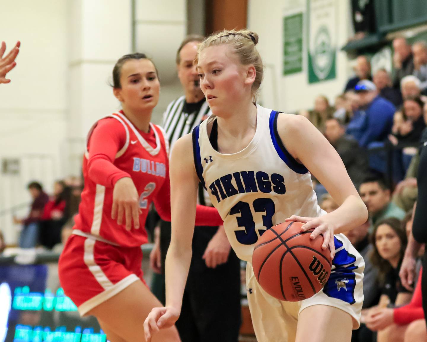 Geneva's Lauren Slagle (33) drives baseline during Class 4A Glenbard West Sectional final game between Geneva at Batavia.  Feb 23, 2023.