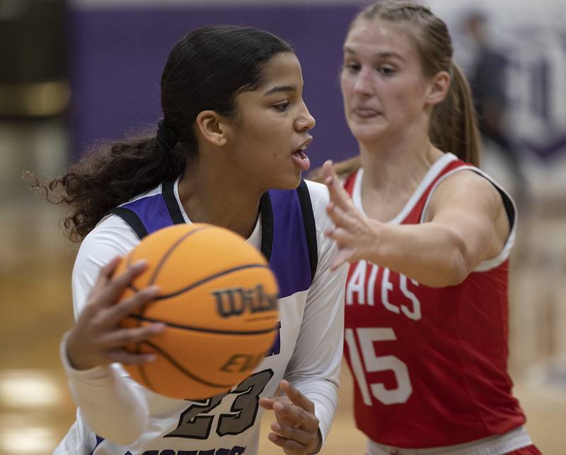 Dixon’s Ahmyrie McGowan makes a pass against Ottawa Wednesday, Dec. 4, 2024, at Dixon High School.