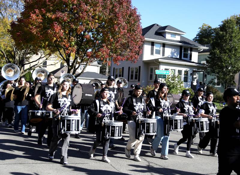 The Downers Grove North Marching Band performs on Friday, Oct. 18, 2024 during the school’s annual homecoming parade.