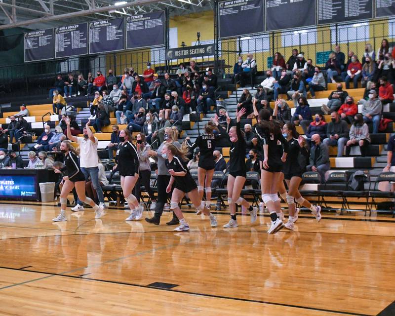 Kaneland volleyball bench celebrates on Monday Nov. 1st as they became won over Crystal Lake South to move on to the sectional championship game.