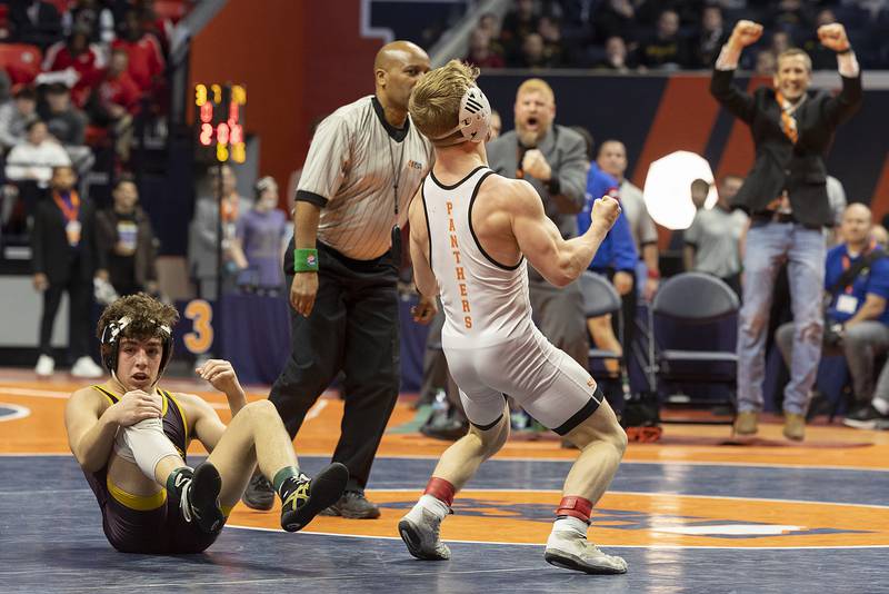 Washington’s Noah Woods celebrates his win over Montini’s Mikey Malizzio in the 120 pound weight class of the 2A state individual wrestling finals Saturday, Feb. 22, 2025, at State Farm Center in Champaign.