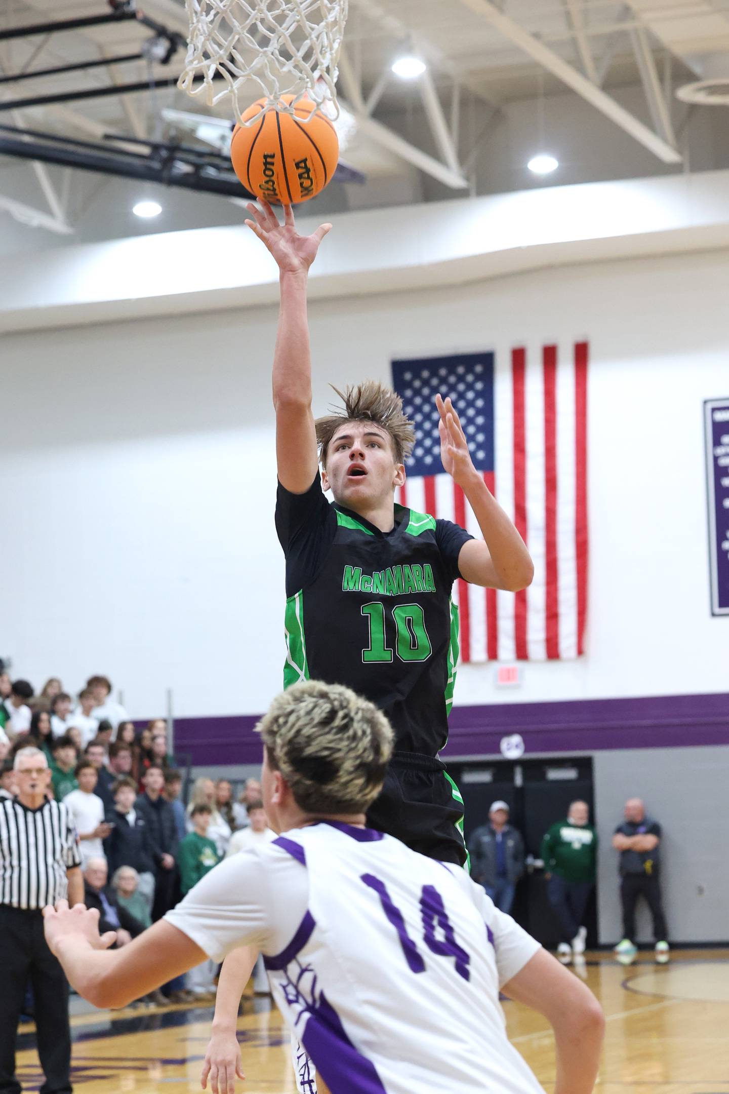 Bishop McNamara's Coen Demack hits a jump shot during the Fightin' Irish's 61-24 victory over Manteno on Tuesday, Jan. 13, 2026.