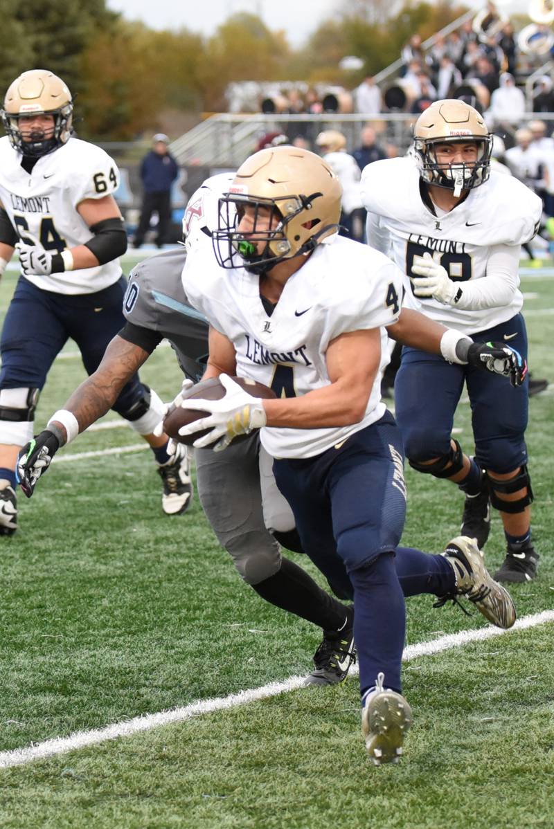 Lemont's Aiden Rudman runs the ball during Lemont's IHSA Class 5A playoff game at Kankakee Saturday, Nov. 1, 2025.