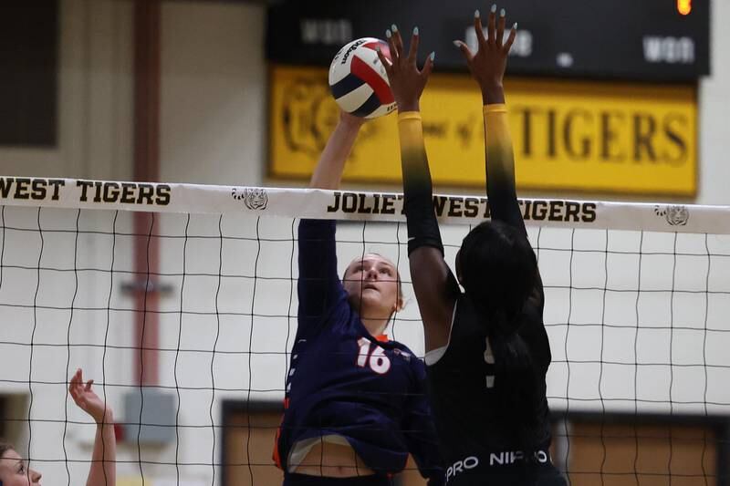 Romeoville’s Aubrea Baldwin pushes over a shot against Joliet West on Thursday, Sept. 5, 2024 in Joliet.