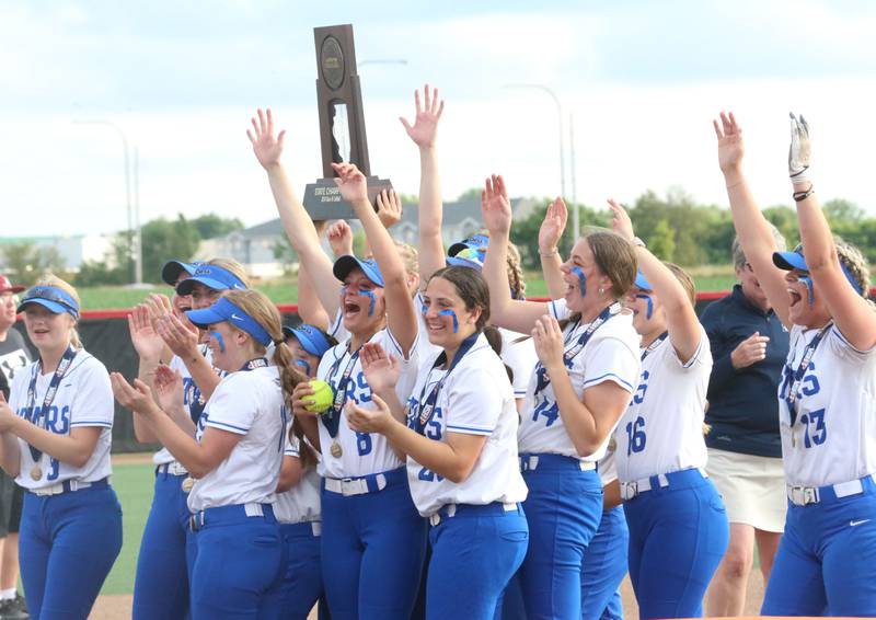 Members of the St. Charles North softball team hoist the Class 4A championship trophy after defeating Marist on Saturday, June 8, 2024 at the Louisville Slugger Sports Complex in Peoria.