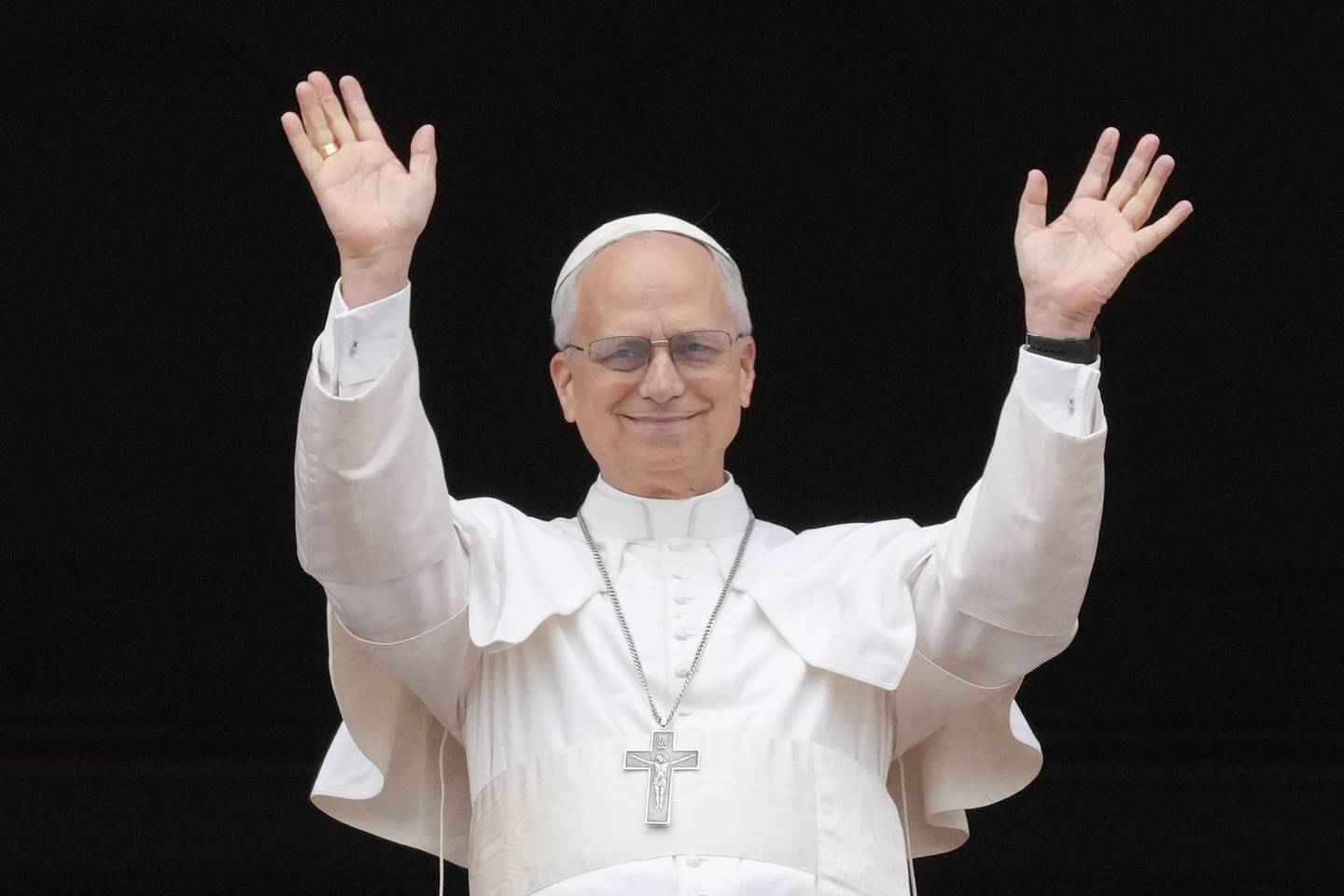 Pope Leo XIV appears at the central balcony of St. Peter's Basilica for his first Sunday blessing after his election, in St. Peter's Square at the Vatican, Sunday, May 11, 2025.(AP Photo/Gregorio Borgia)