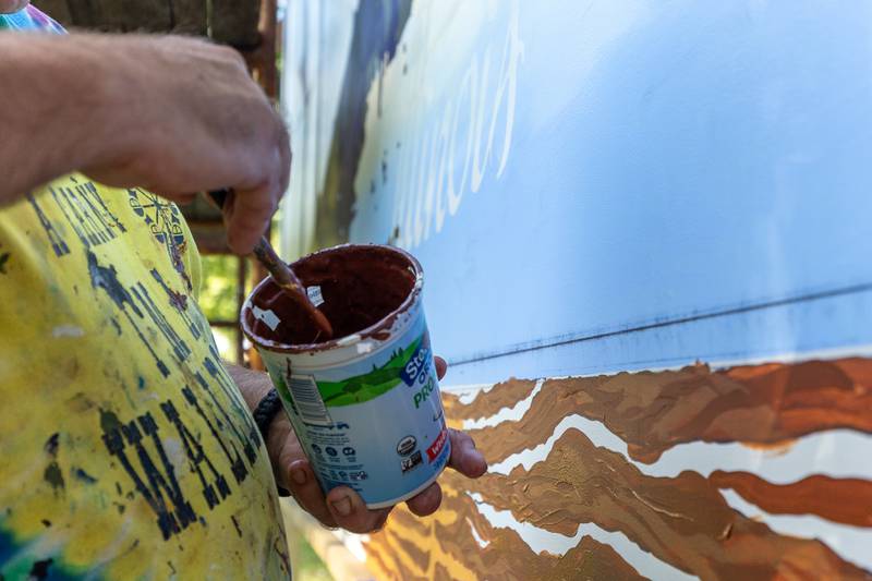 Doug Haffner of the Walldogs dips brush in paint on Thursday, Sept. 11, 2025 at City Park in Streator.