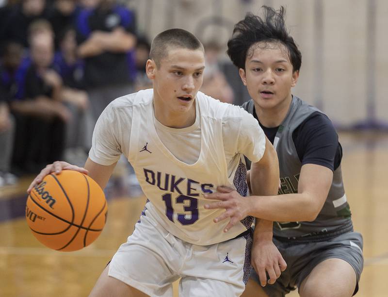Dixon’s Cullen Shaner works against Plainfield Central’s Shadric Ticala Friday, Jan. 3, 2025, at Dixon High School.