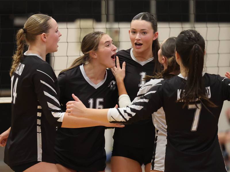Kaneland players celebrate a point during their match against Sycamore Tuesday, Sept. 30, 2025, at Kaneland High School in Maple Park.
