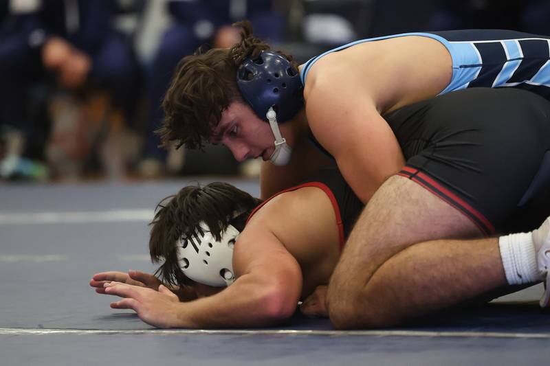 Plainfield South’s Chase Peirceall works over Plainfield North’s Sam Zito in a Southwest Prairie dual meet on Wednesday, Nov. 29, 2023 in Plainfield.