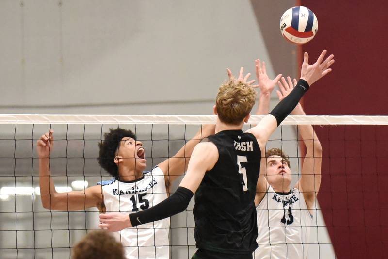 Kankakee's Joshua Anderson, left, and Eli Cunningham, right, look to block a hit from Bishop McNamara's Richie Darr during a game at Kankakee Tuesday, March 31, 2026.