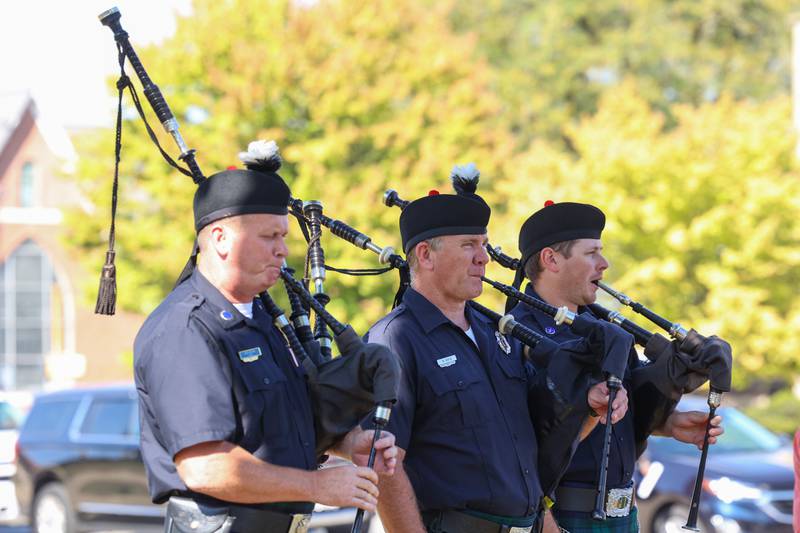 Kankakee Fire Department's Capt. Dave Wiechen, left, firefighter Nate Boyce, center, and Lt. Jeremy Wichtner perform "Amazing Grace" on bagpipes during the 44th Kankakee County Fallen Firefighter Memorial Service on Friday, Oct. 3, 2025.