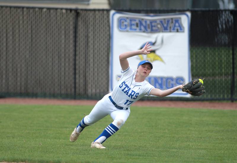 St. Charles North's Miranda Quigley attempts a reaching catch in center field during a game against Lake Park on Wednesday, April 30, 2025 in St. Charles.