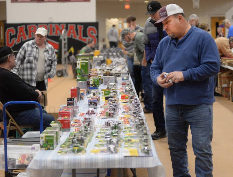 James Storey of German Valley checks out some of the items for sale at the Forreston FFA Alumni's Farm Toy and Craft Show on Saturday, March 8, 2025 at the Forreston High School.