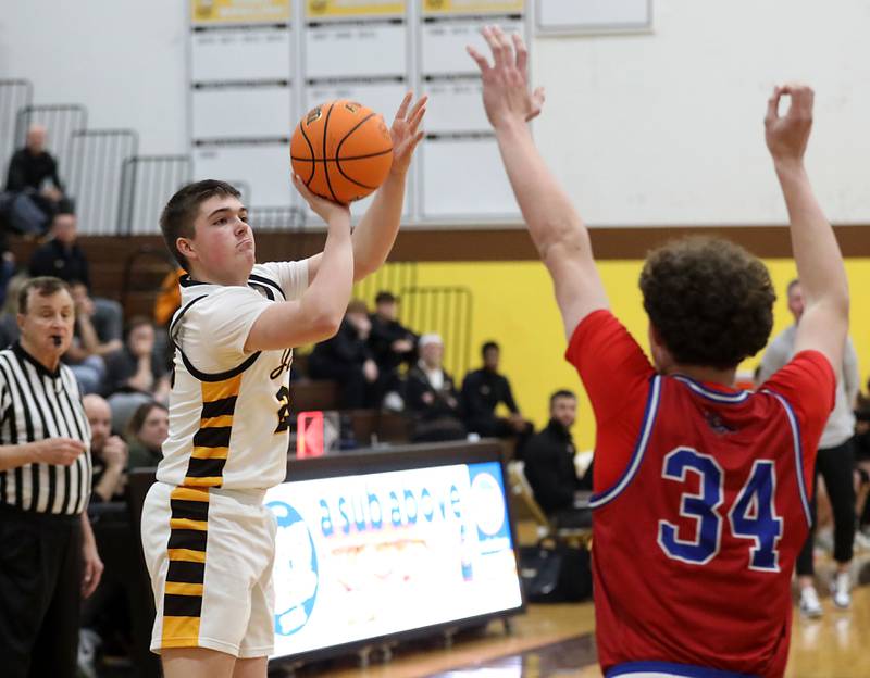 Jacobs' George Donze shoots the ball over Dundee-Crown's Hudson Reardon during a Fox Valley Conference boys basketball game on Tuesday, February. 3, 2026, at Jacobs High School in Algonquin.