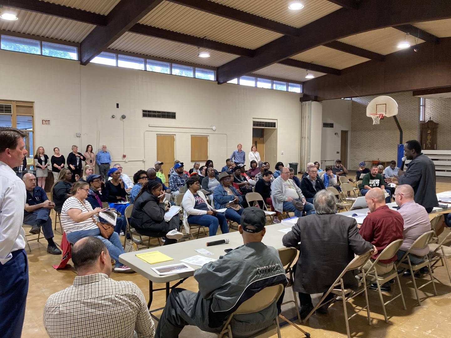 Kankakee residents listen to a representative from the Illinois Department of Education at Tuesday's informational meeting on the Interestate 57's 312 interchange project. Kankakee Mayor Chris Curtis stands at left.