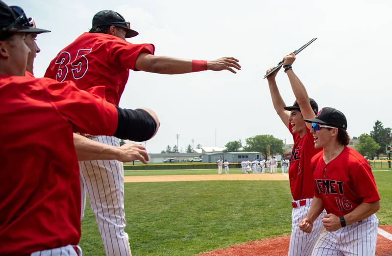 Benet Academy pitcher Gino Zagorac holds up the IHSA Class 3A Kaneland Sectional final trophy after Benet Academy won 7-0 over St. Francis High School at Kaneland High School in Maple Park on Saturday, June 7, 2025.