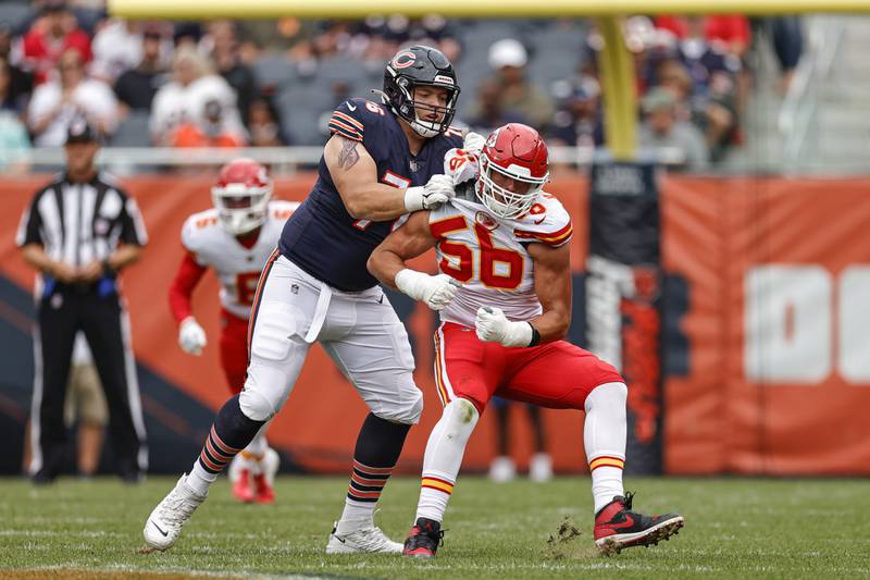 Chicago Bears offensive tackle Teven Jenkins, left, fights for position with Kansas City Chiefs defensive end George Karlaftis, right, during the first half of a preseason game, Saturday, Aug. 13, 2022, in Chicago.
