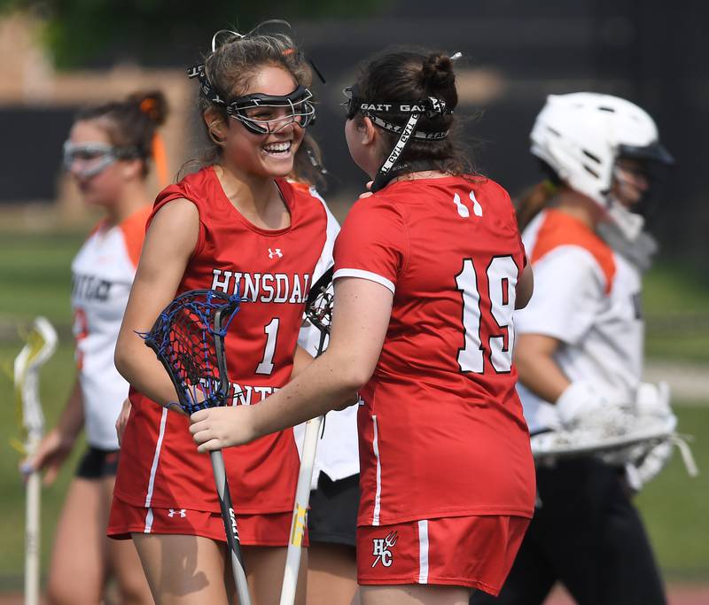 Hinsdale Central’s Ella Parker-Briones, left, celebrates her goal that was assisted by Maggie Conley during the third-place game of the girls lacrosse state finals, which was played against Crystal Lake Central Coop, at Hinsdale Central High School on Saturday, June 7, 2025.