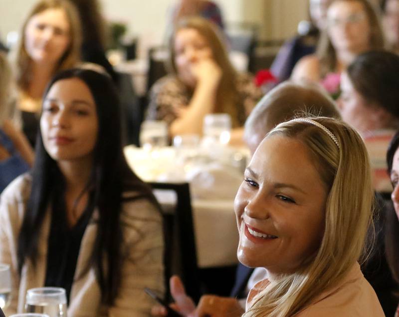 Award recipient Laura Dzielski-Johnson  listens to award recipient Debbie Gallagher speak during the Northwest Herald's Women of Distinction award luncheon Wednesday June 7, 2023, at Boulder Ridge Country Club, in Lake in the Hills. The luncheon recognized 10 women in the community as Women of Distinction.