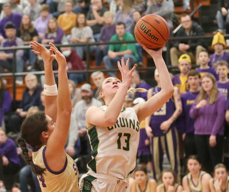 St. Bede's Ashlyn Ehm eyes the hoop over Serena's Paisley Twait during the Class 1A Sectional final game on Thursday, Feb. 22, 2024 at Gardner-South Wilmington High School.