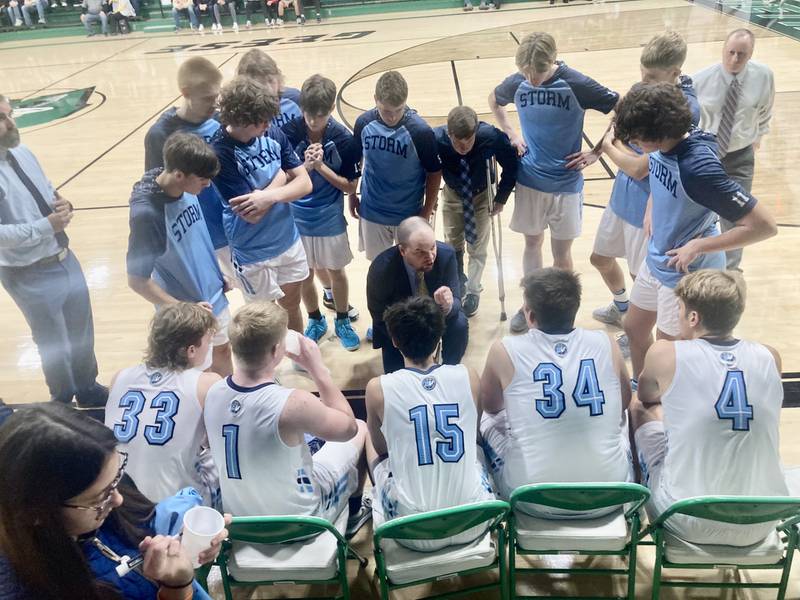 Bureau Valley coach Jason Marquis instructs his team prior to tip off of Wednesday's game with Putnam County. The Storm won 50-38 to improve to 2-1.