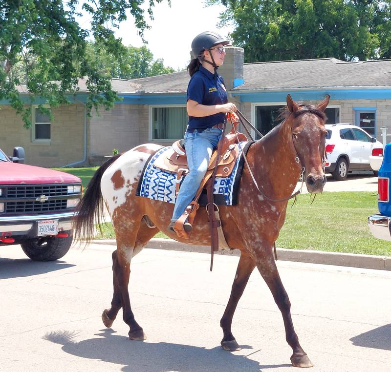 Horse riders take part in the Marseilles Fun Days parade Sunday, July 9, 2023.