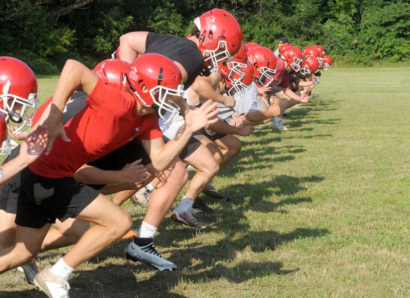 Yorkville players run sprints during football practice at Yorkville High School on Tuesday, Aug 8, 2023.
