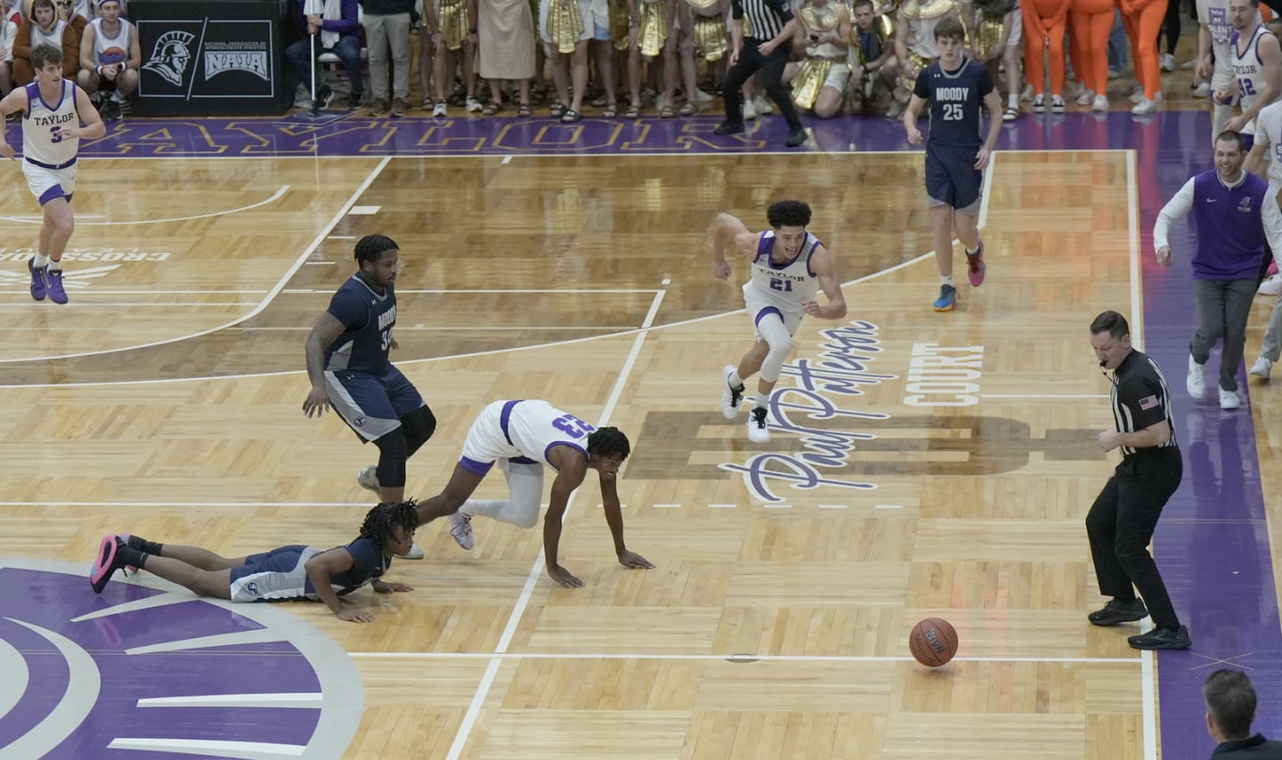 Princeton native John Washo (right) officiated the famous "Silent Night" game at Taylor University in Upland, Ind. on Dec. 6. A 1997 PHS grad, Washo has coached at the collegiate level for 17 years.