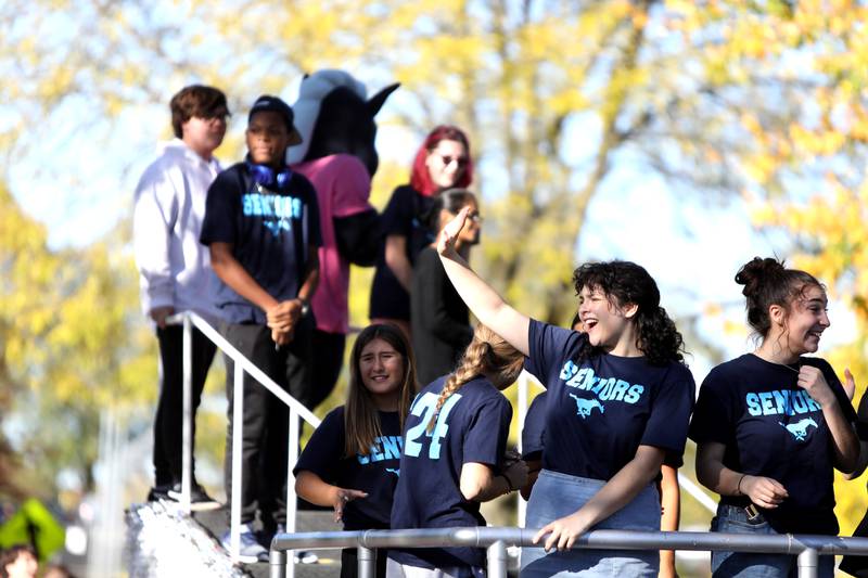 Members of the Downers Grove South senior class march in the school’s annual homecoming parade on Friday, Oct. 20, 2023.