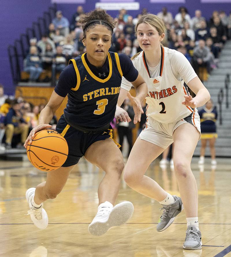 Sterling’s Delali Amankwa drives by Washington’s Avery Tibbs Monday, March 3, 2025, during the 3A Supersectional at Rochelle High School.