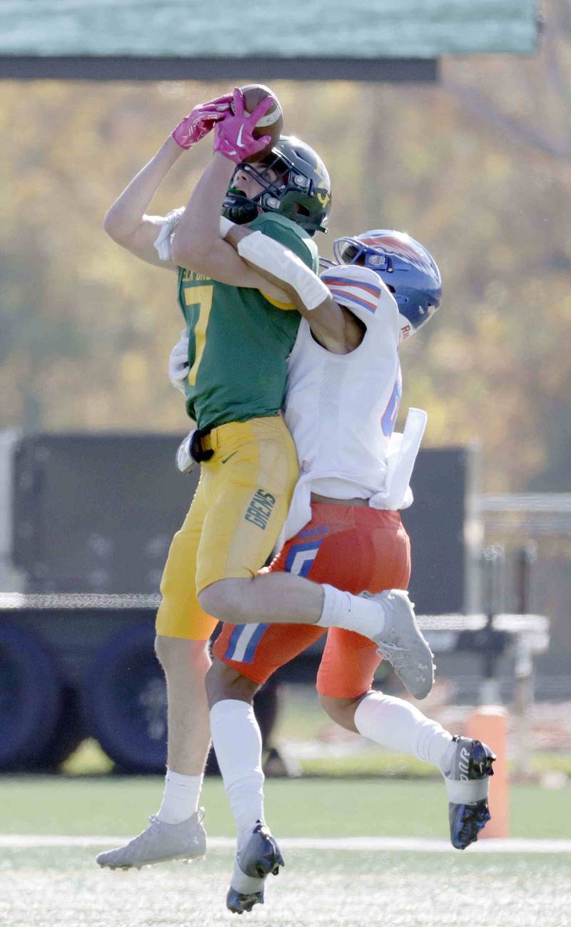 Hoffman Estates' Jayleon Johnson, 6, tries to stop Elk Grove's Lucas Rogers, 7, from catching a long pass Saturday October 29, 2022 in Elk Grove Village.