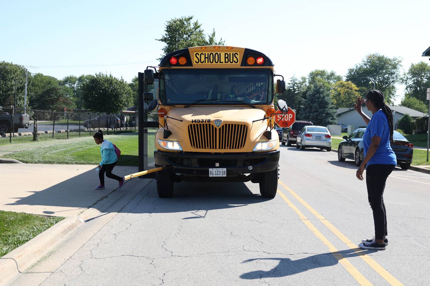 Shayla Day, right, greets her daughter Sasha, 7 years-old, as she gets off the bus. First Student and theTeamsters union report that they have reached a tentative contract agreement to avoid a strike. Monday, Sept. 19, 2022, in Joliet.