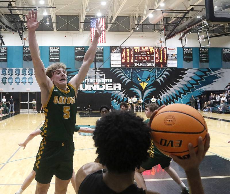 Crystal Lake South's Carson Trivellini tries to intercept the inbounds pass from Kaneland's Jalen Carter during the IHSA Class 3A Woodstock North Sectional final basketball game on Friday, March 6, 2026, at Woodstock North High School.
