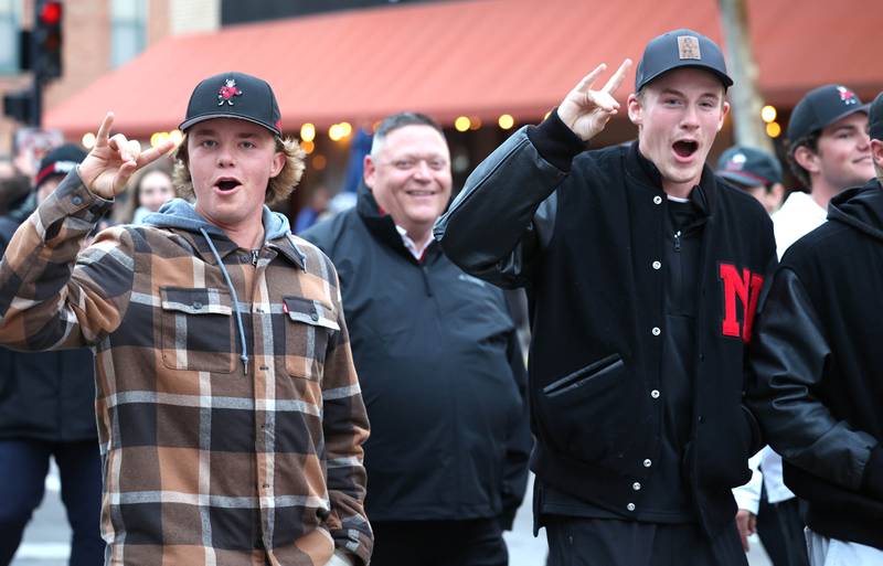 Northern Illinois University student athletes walk in the March of the Huskies parade during the NIU Huskie Homecoming Block Party Thursday, Oct. 12, 2023, in downtown DeKalb.