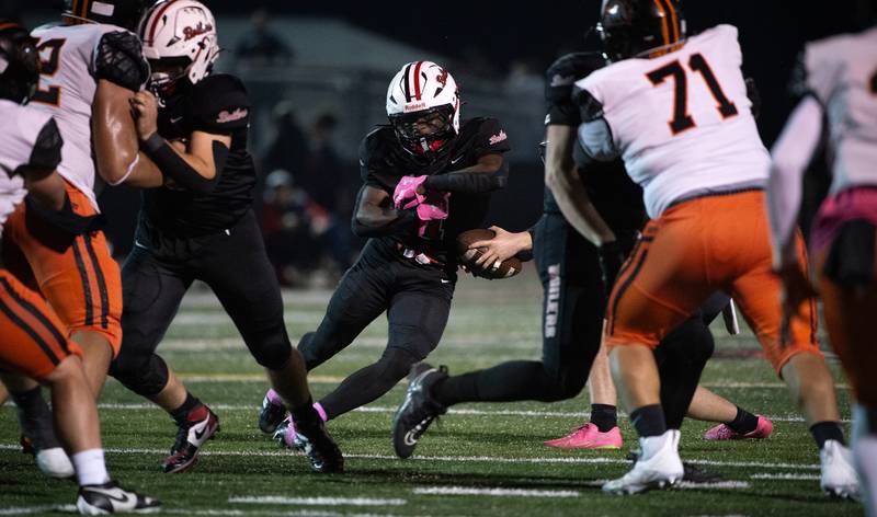 Bradley-Bourbonnais' Kyren Edmon is handed the ball on a play in a game against Dekalb on Friday, October 10, 2025.