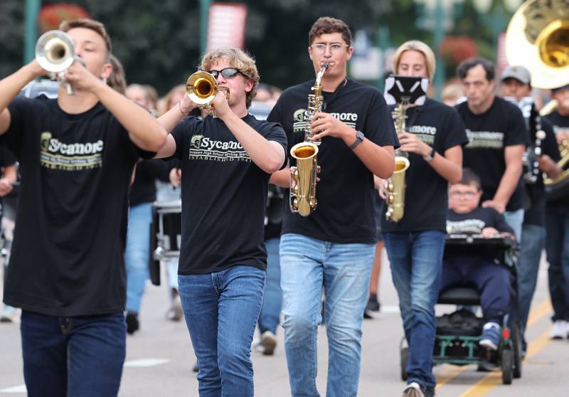 The Sycamore High School marching band heads down State Street Wednesday, Sept. 20, 2023, during the Sycamore High School homecoming parade.