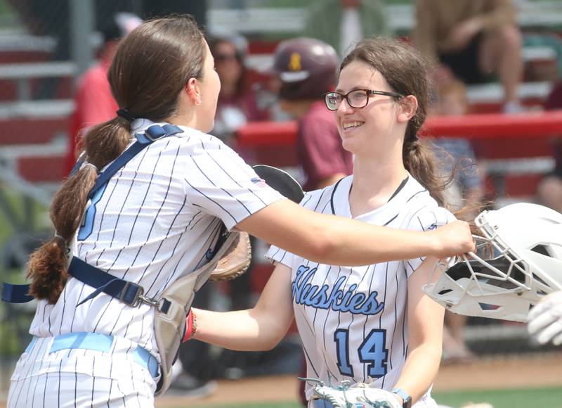 Oak Park River Forest catcher Liliana Janeczko hugs teammate Elyssa Hasapis after making an out against Lockport during the Class 4A third-place game on Saturday, June 14, 2025 at the Louisville Slugger Sports Complex in Peoria.