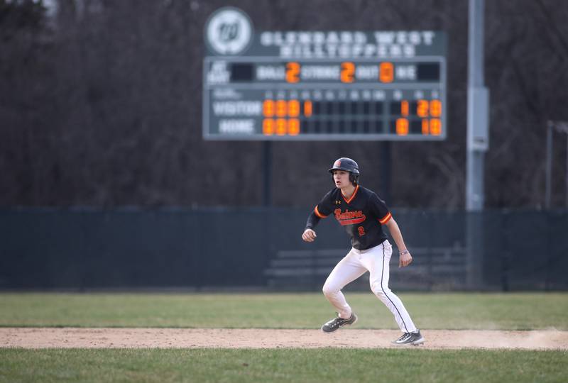 Batavia’s Jacob Aseltine leads off from second base during a game against Glenbard West at Village Green Park in Glen Ellyn on Wednesday, March 13, 2024.
