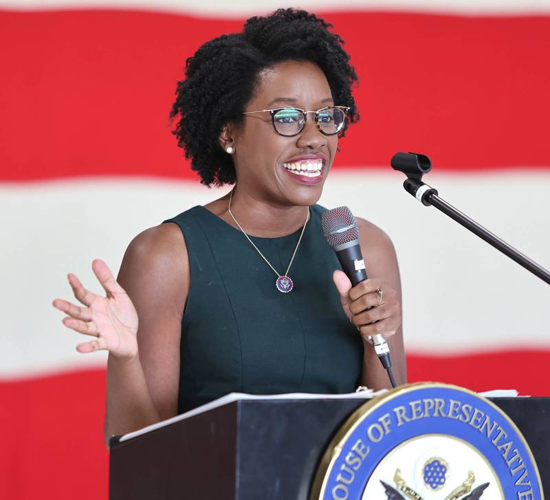 U.S. Rep. Lauren Underwood, D-Naperville, reacts to the ovation she receives as she comes to the podium Tuesday, Aug. 23, 2022, during a town hall meeting at the DeKalb Taylor Municipal Airport.