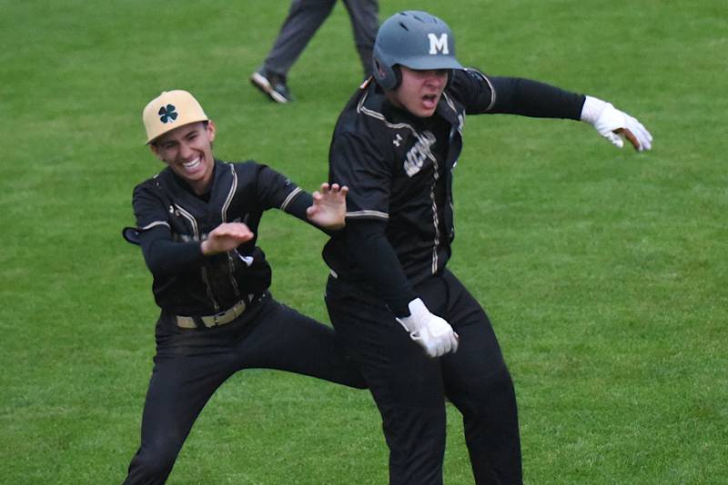 Bishop McNamara's Ian Irps, right, is congratulated by teammate Nolan Andrews after his walk-off single during a home game against Hope Academy Thursday, April 30, 2026.