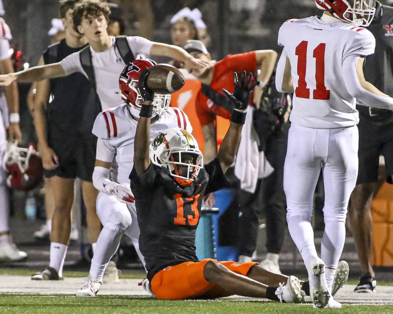 Plainfield East's Markeith Taylor (13) reacts after making a sideline catch during football game between Yorkville at Plainfield East Friday, Sept 19, 2025 in Plainfield.