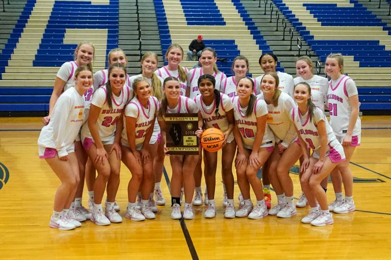 Batavia players pose for photos after defeating York to win a Class 4A Geneva Regional final basketball game at Geneva High School on Thursday, Feb. 20, 2025.