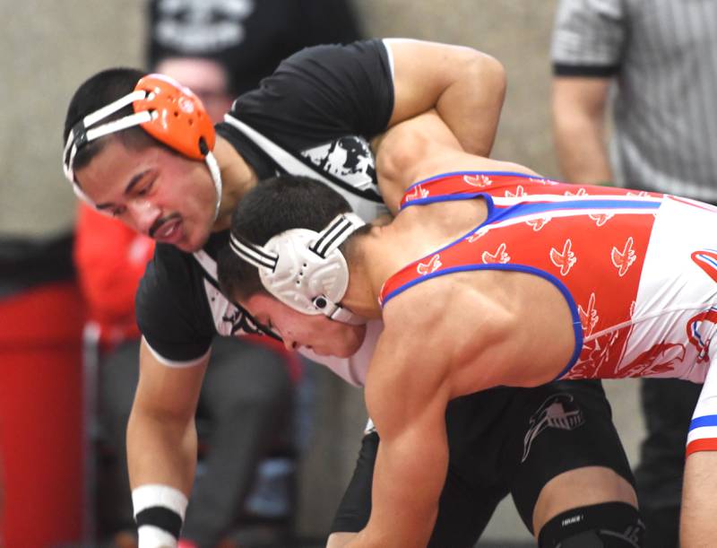 Kaneland's Josh Kather (left) wrestles Oregon's Cole Suter at 165 pounds at the Stillman Valley Holiday Tournament on Saturday, Dec. 20, 2025 at Stillman Valley High School.