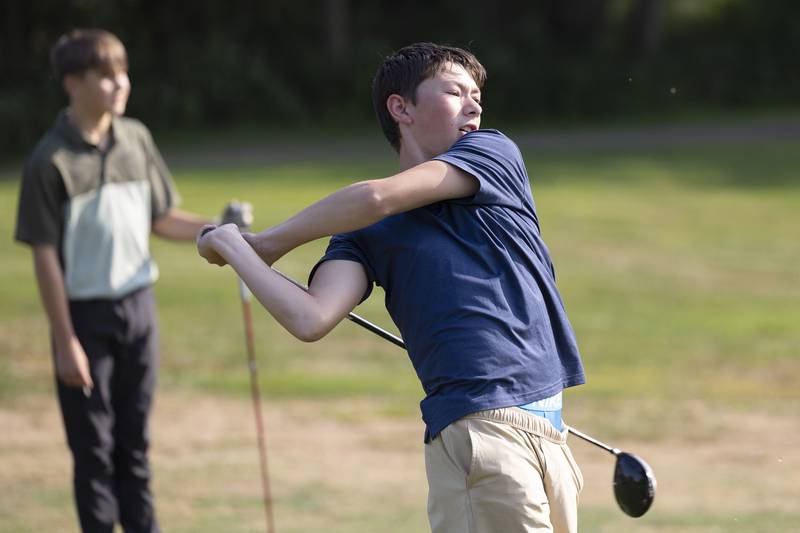 Brycen Imfeld, 13, gives it his all Wednesday, Sept. 10, 2025, on his tee off in Dixon.