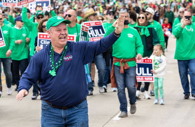 Mayoral candidate Clint Hull waves to the crowd during the St. Charles St. Patrick’s Parade on Main Street in St. Charles on Saturday, March 15, 2025.
