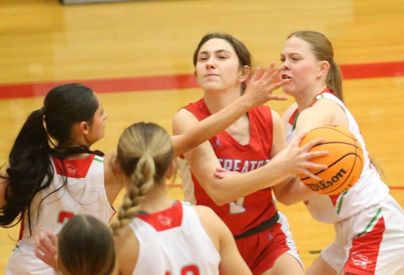 Streator's Audrey Arambula fights through the lane into L-P defenders (from left) Nathali Augirre, Kelsey Frederick and Elizabeth Sines on Tuesday, Jan. 28, 2025 in Sellett Gymnasium at L-P High School.