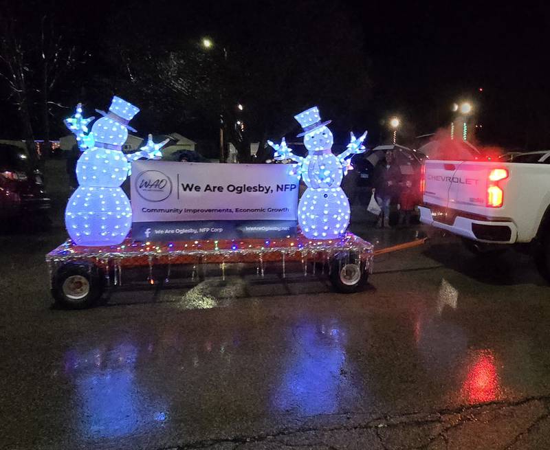 The We Are Oglesby lighted float makes its way Saturday, Dec. 14, 2024, along Walnut Street. Saturday's activities were organized by the event was organized by the nonprofit group, We Are Oglesby, NFP.
