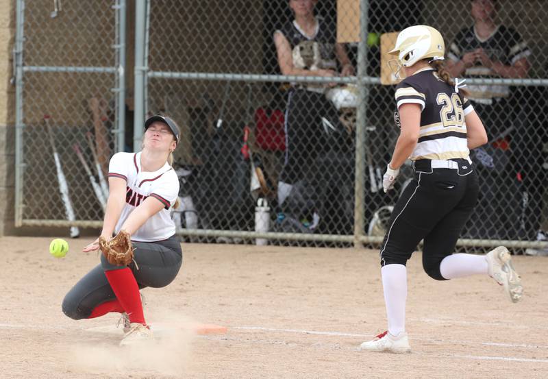 Ottawa’s Piper Lewis can’t come up with the low throw allowing Sycamore's Kaitlyn Williams to reach first base during their game Thursday, May 2, 2024, at Sycamore High School.